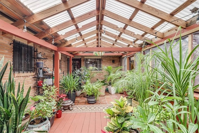 unfurnished sunroom with vaulted ceiling