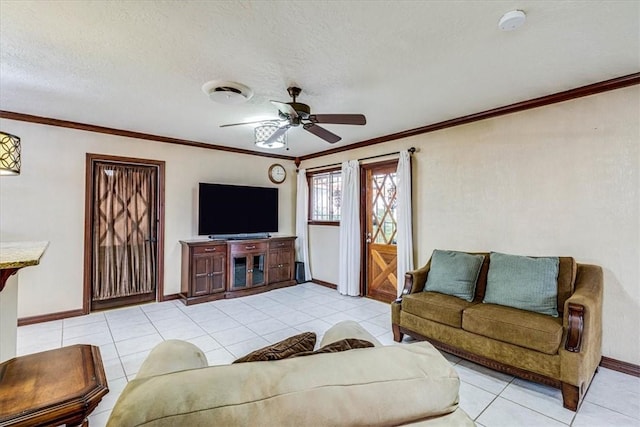 tiled living room featuring crown molding, ceiling fan, and a textured ceiling