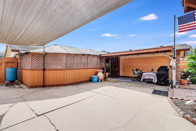 view of patio featuring a garage