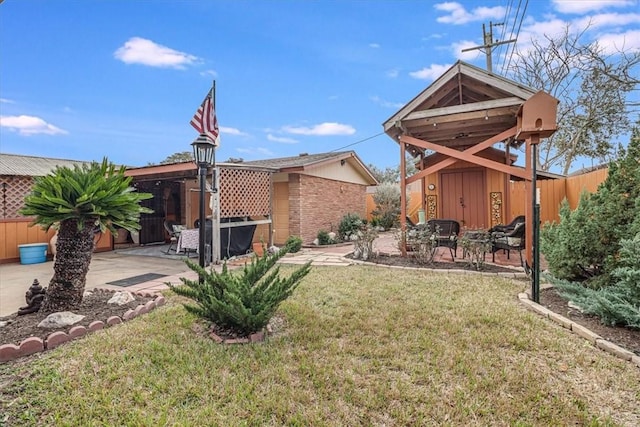 view of yard with a shed and a patio area