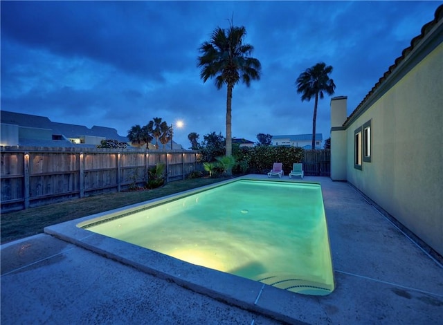 view of swimming pool featuring a fenced backyard