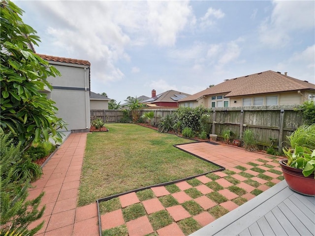view of yard featuring a patio and a fenced backyard