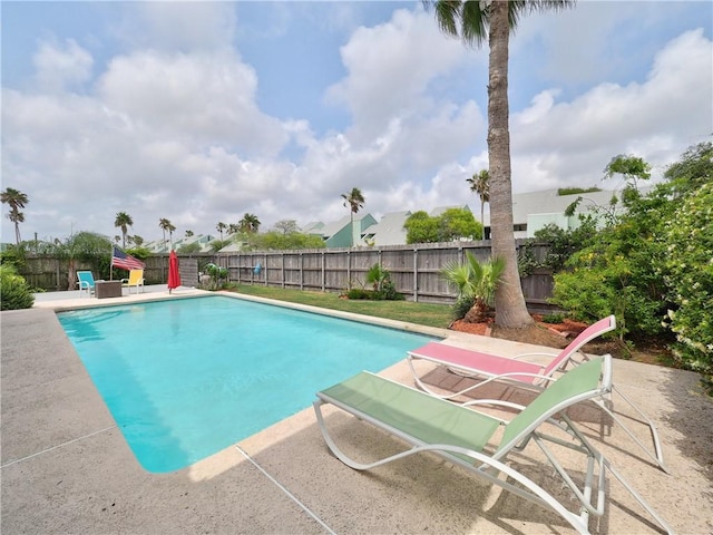 view of pool with a fenced in pool, a fenced backyard, and a patio area