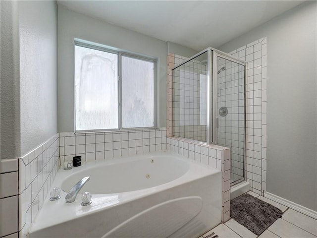 full bath featuring tile patterned floors, a bath, and a stall shower
