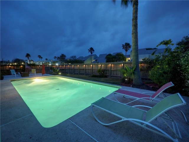 view of pool featuring a fenced backyard, a fenced in pool, and a patio
