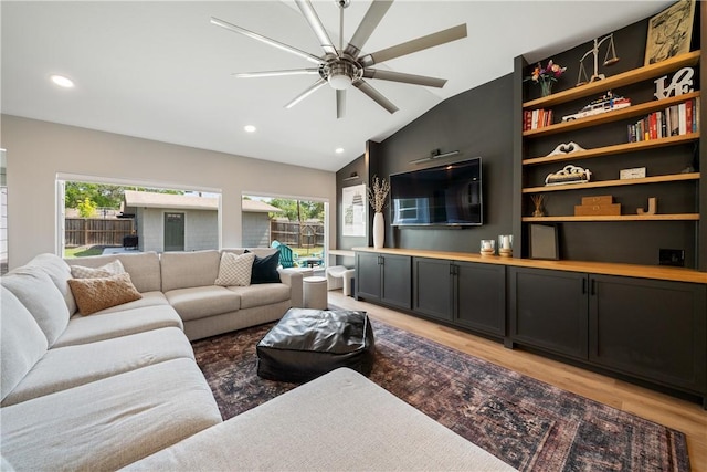living area with ceiling fan, recessed lighting, light wood-style floors, and plenty of natural light