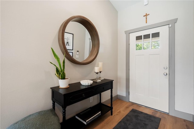 entrance foyer with light wood-style flooring and baseboards