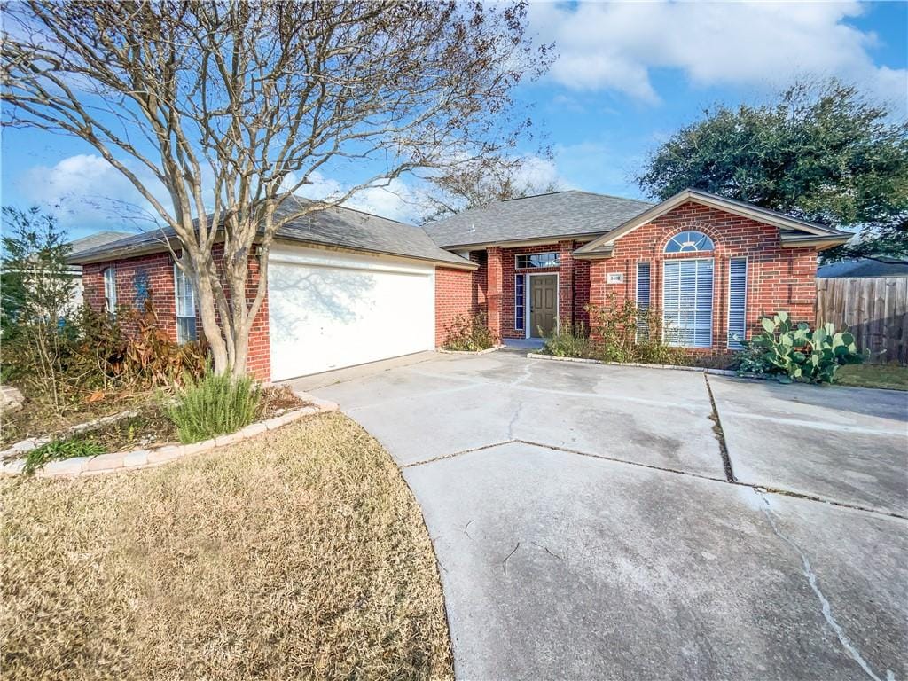 ranch-style house featuring a garage