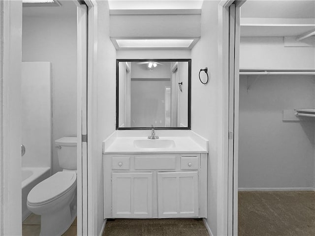 full bathroom with toilet, shower / bathing tub combination, and vanity