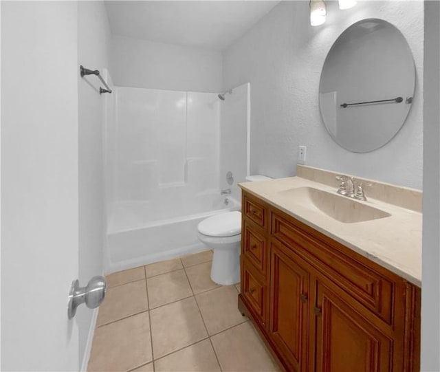 full bathroom featuring tub / shower combination, vanity, tile patterned floors, and toilet