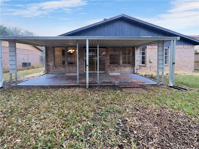 back of property featuring a patio