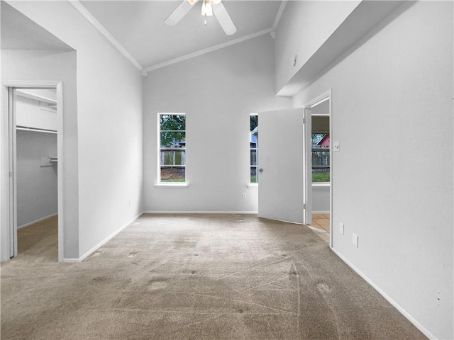 interior space featuring high vaulted ceiling, ceiling fan, and crown molding