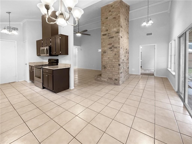 kitchen with ceiling fan with notable chandelier, appliances with stainless steel finishes, hanging light fixtures, and dark brown cabinetry