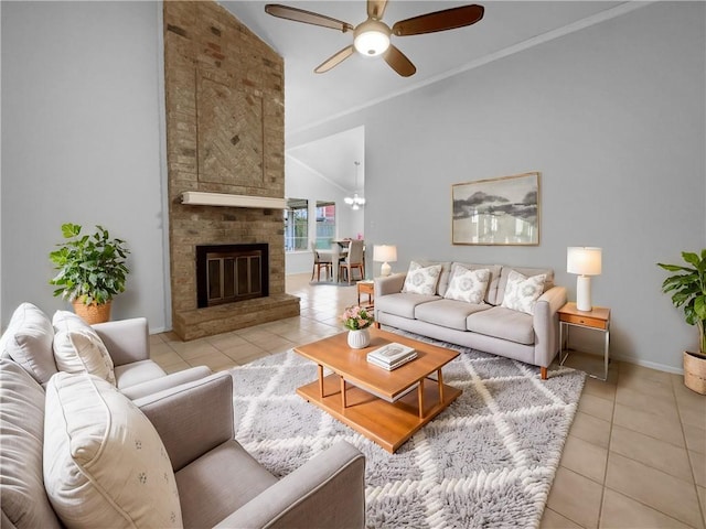 tiled living room with a brick fireplace, ceiling fan, vaulted ceiling, and crown molding