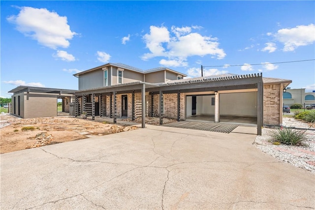 200 Elm St, Portland, TX 78374 - view of front of home with brick siding and a porch
