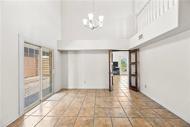 200 Elm St, Portland, TX 78374 - empty room featuring a towering ceiling and a chandelier