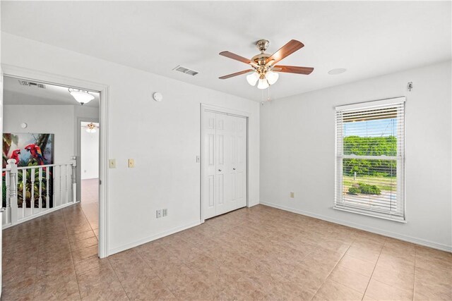 200 Elm St, Portland, TX 78374 - unfurnished bedroom featuring light tile patterned floors, a ceiling fan, and a closet