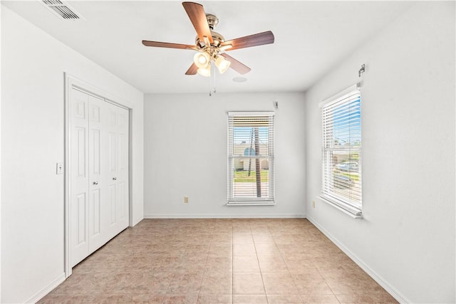 200 Elm St, Portland, TX 78374 - unfurnished bedroom featuring a closet, a ceiling fan, and light tile patterned floors