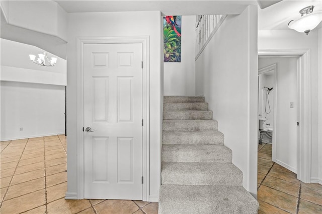 200 Elm St, Portland, TX 78374 - stairway featuring tile patterned floors and a chandelier