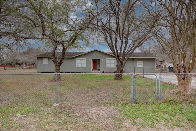 ranch-style house with a gate, fence, and a front lawn