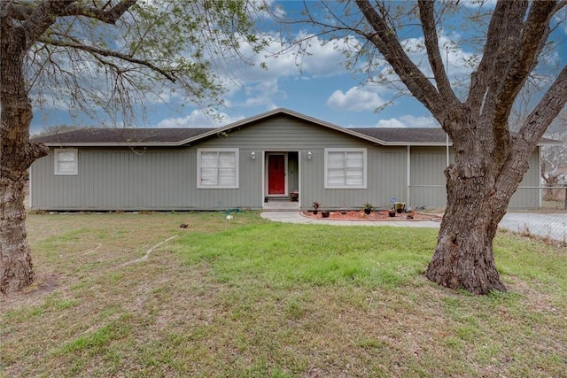 single story home with a front lawn and fence