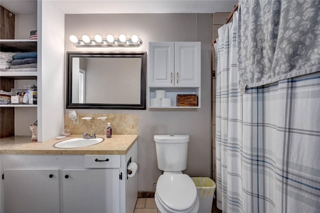 full bathroom featuring toilet, tile patterned flooring, vanity, and a shower with curtain