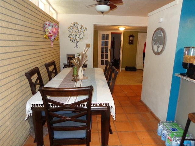 tiled dining room with ceiling fan