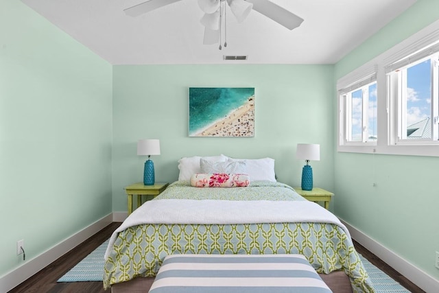 bedroom featuring dark wood-type flooring and ceiling fan