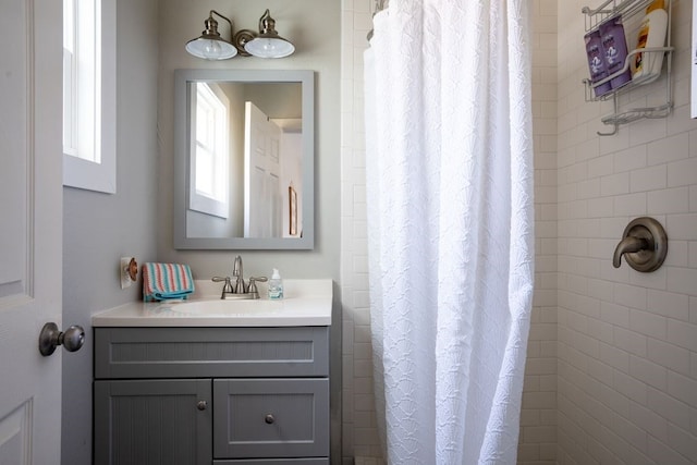 bathroom with vanity and a shower with shower curtain