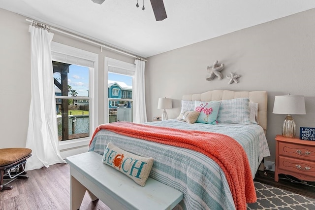 bedroom featuring dark hardwood / wood-style flooring and ceiling fan