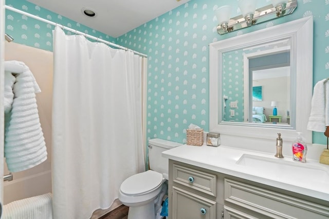 bathroom with toilet and vanity