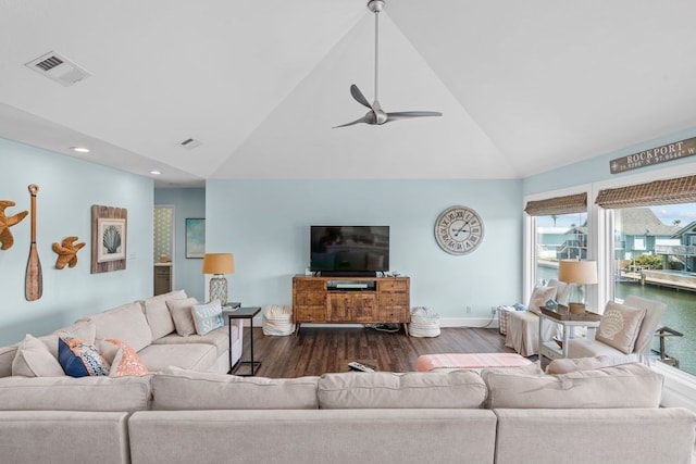 living room with dark wood-type flooring, ceiling fan, and high vaulted ceiling