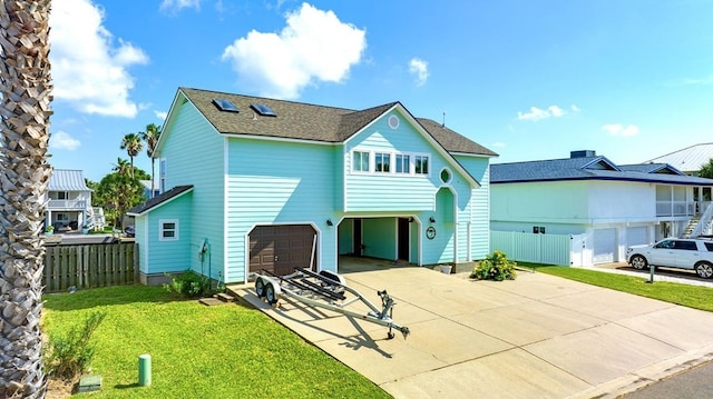 view of front of house with a front lawn and a garage