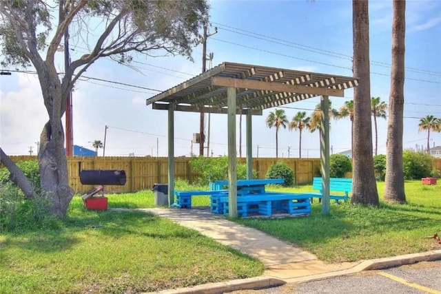 view of community with a lawn and a pergola