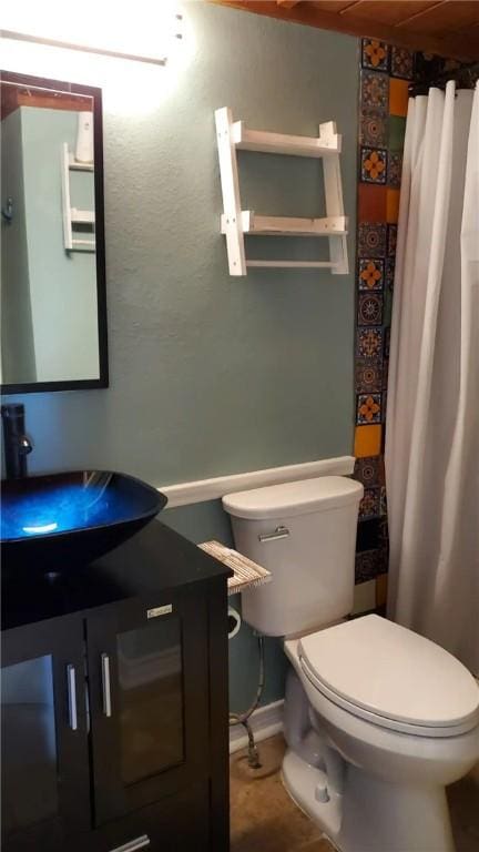 bathroom with tile patterned floors, sink, and toilet