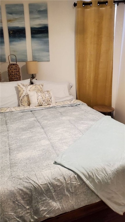 bedroom featuring hardwood / wood-style flooring