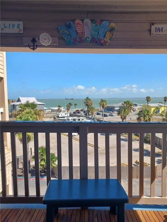 wooden deck featuring a water view