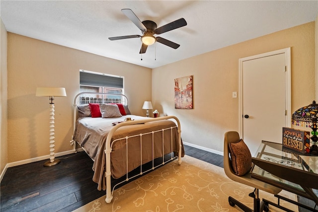 bedroom featuring hardwood / wood-style floors and ceiling fan