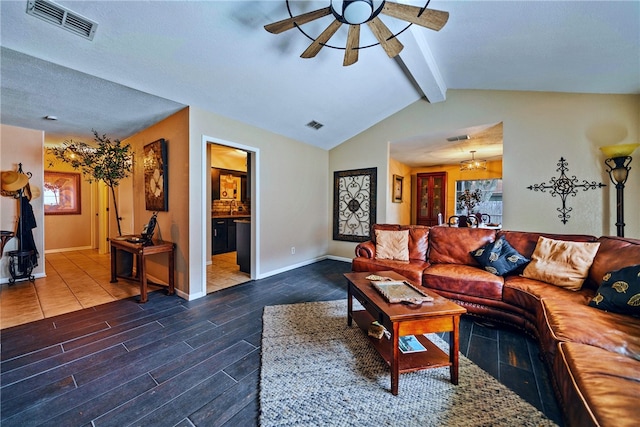 living room featuring ceiling fan and vaulted ceiling with beams