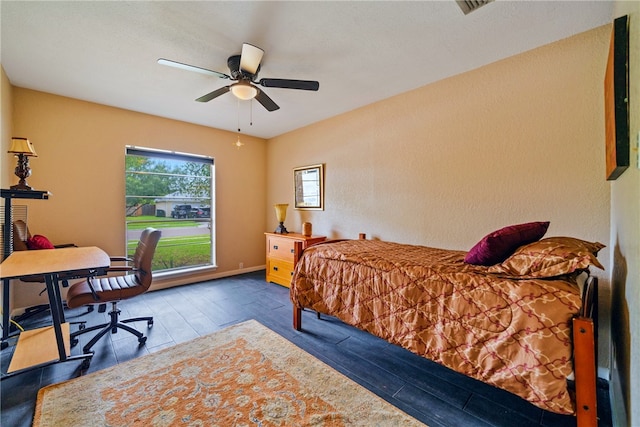 bedroom with hardwood / wood-style flooring and ceiling fan