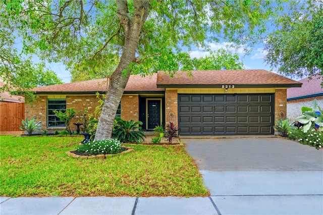 5213 Inverness Dr, Corpus Christi, TX 78413 - single story home with brick siding, an attached garage, driveway, and roof with shingles