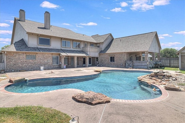 view of swimming pool with a patio