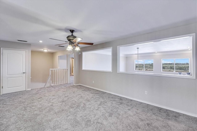 carpeted empty room with ceiling fan