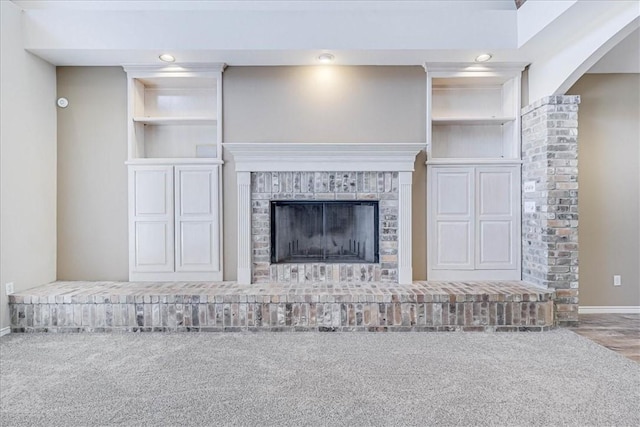 details with carpet floors and a brick fireplace