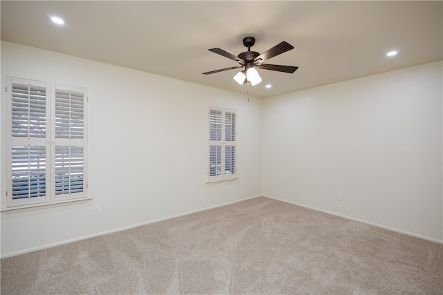 carpeted empty room with ceiling fan