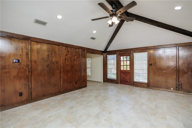 empty room featuring high vaulted ceiling, beamed ceiling, and ceiling fan