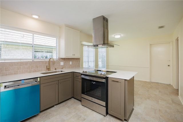 kitchen with island exhaust hood, stainless steel appliances, backsplash, sink, and kitchen peninsula