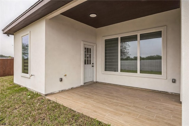 doorway to property featuring a wooden deck