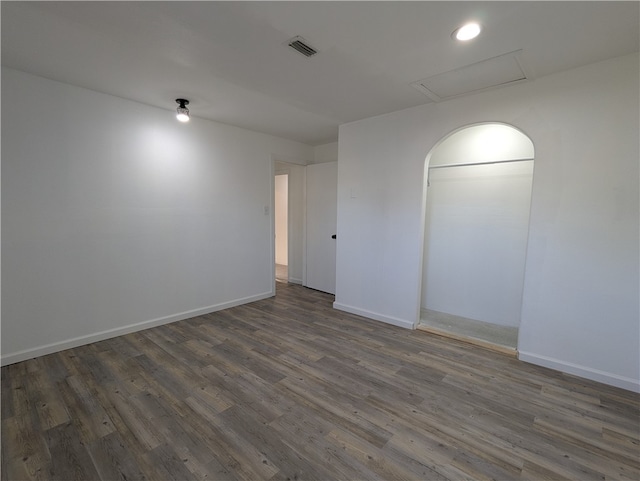 empty room with dark wood-type flooring