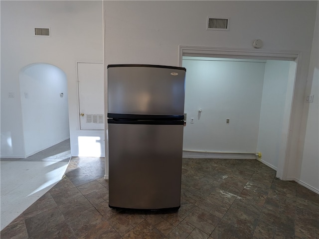 kitchen featuring stainless steel fridge